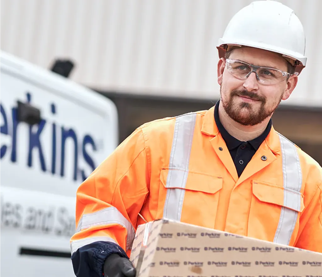 Perkins van with a driver delivering a box
