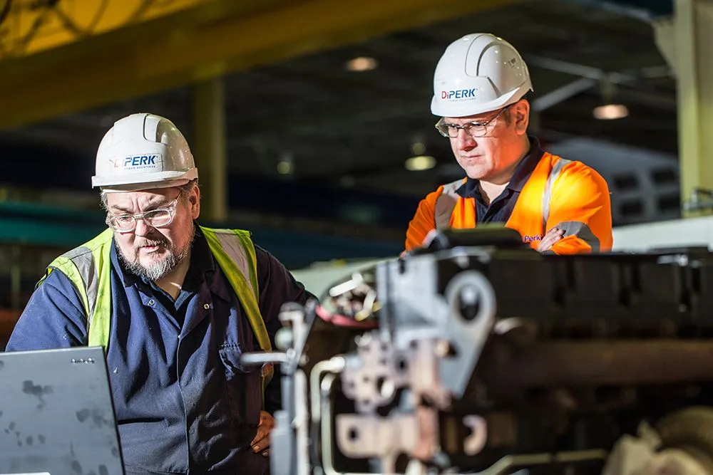 Two engineers working on a Perkins engine